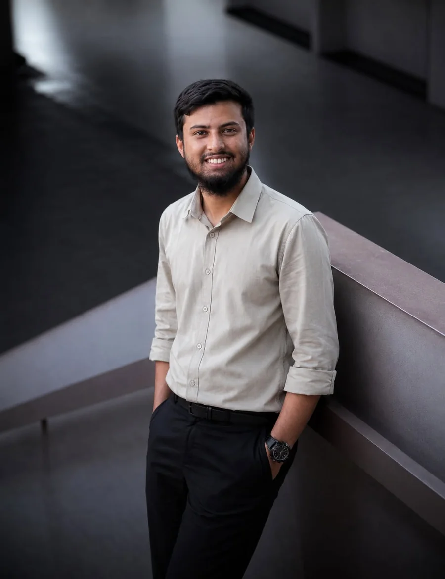 Portrait of Anayet Ullah in a beige shirt